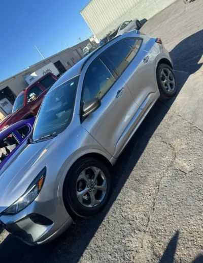 The silver SUV outside in natural light, showing a flawless exterior 2