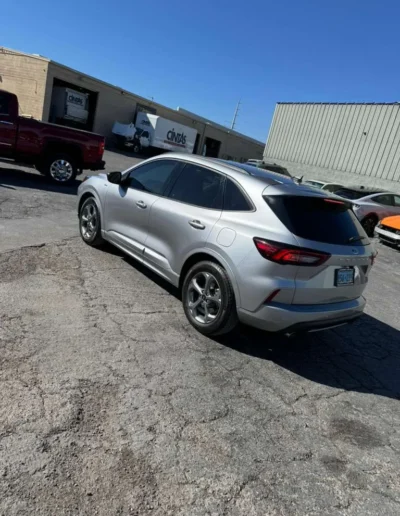 The silver SUV outside in natural light, showing a flawless exterior