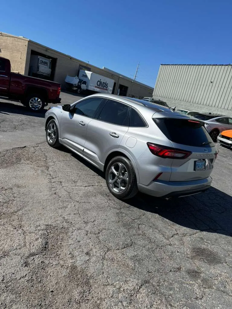The silver SUV outside in natural light, showing a flawless exterior