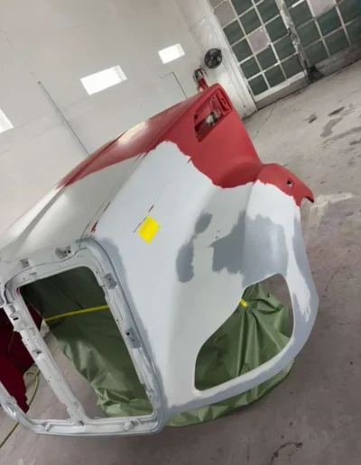 Truck hood with primer and body filler